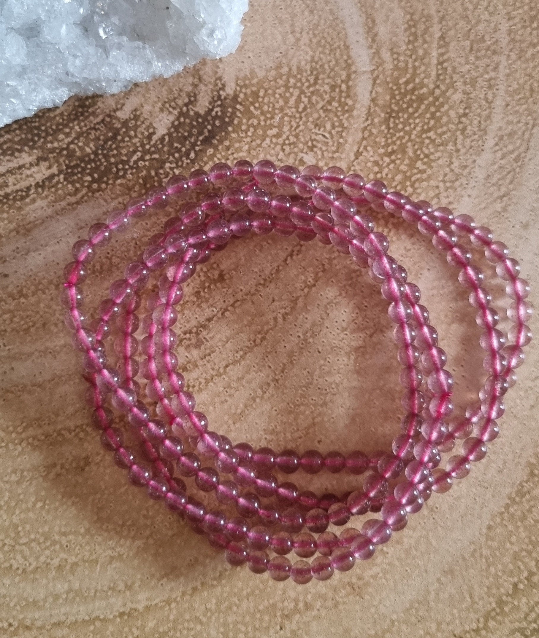 Handmade Stawberry Quartz bracelets with adjustable stretchy banding. Size 6mm