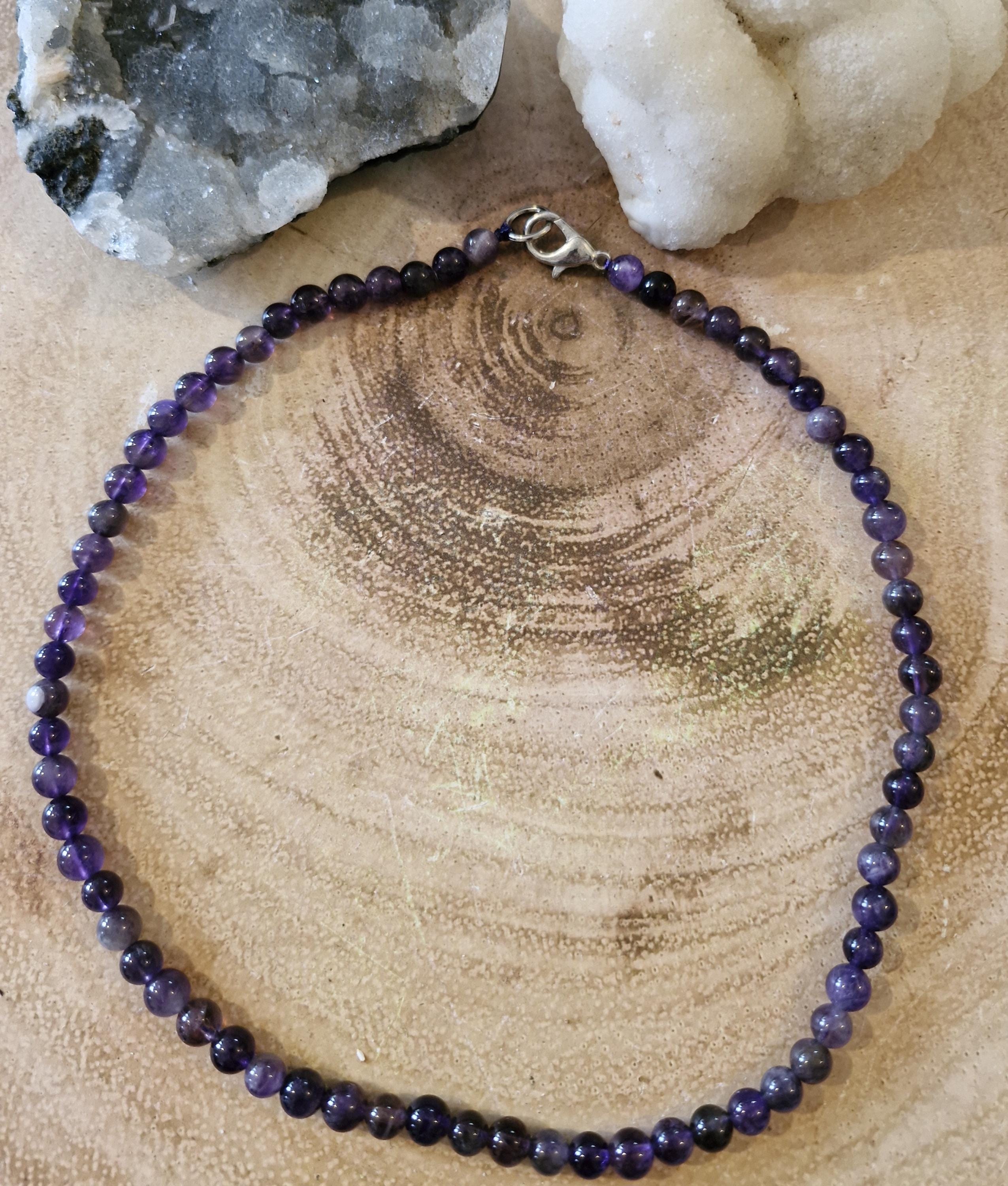 A variety of hand made gemstone/crystal beaded choker necklaces with sliver clasps.