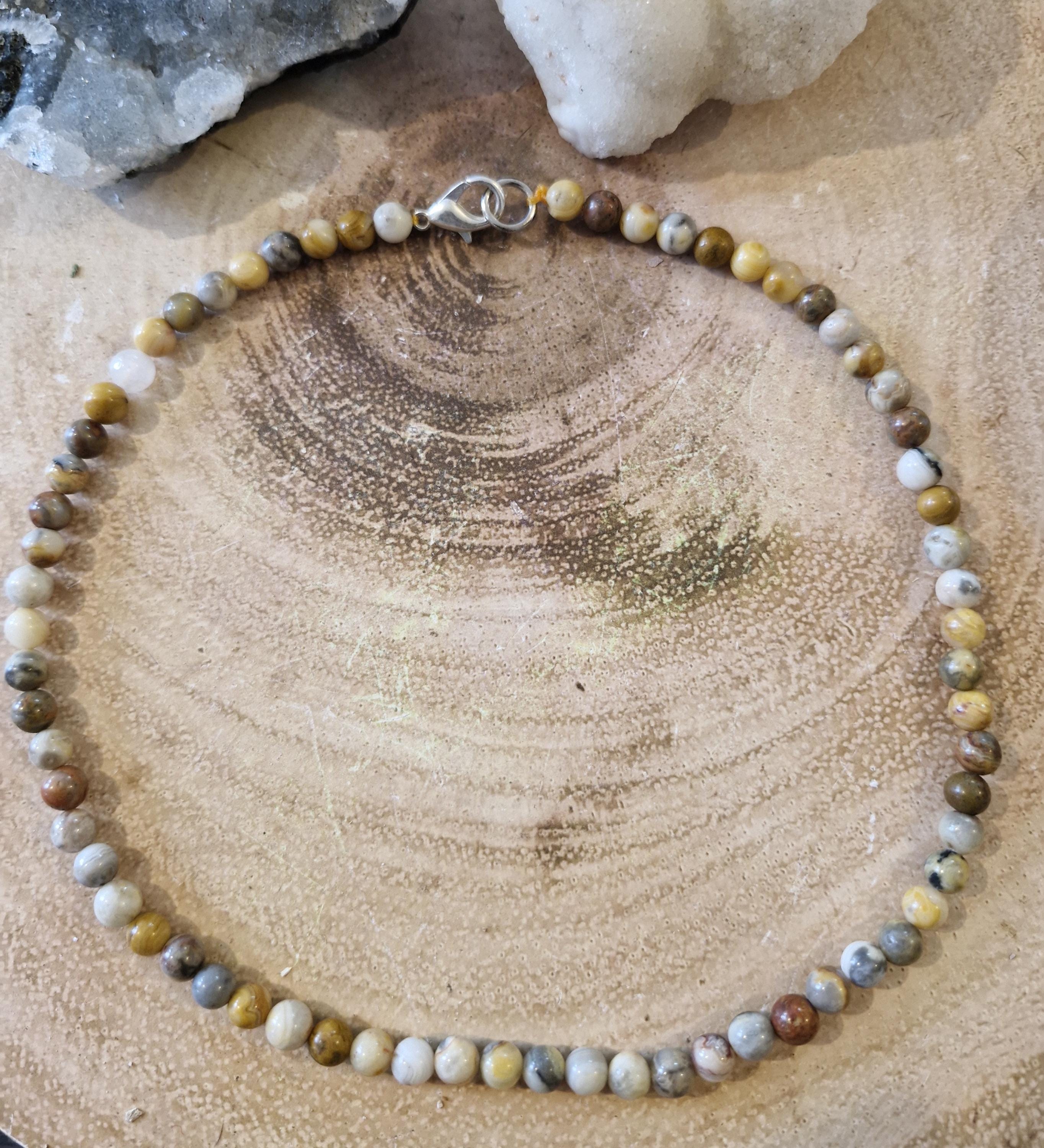 A variety of hand made gemstone/crystal beaded choker necklaces with sliver clasps.