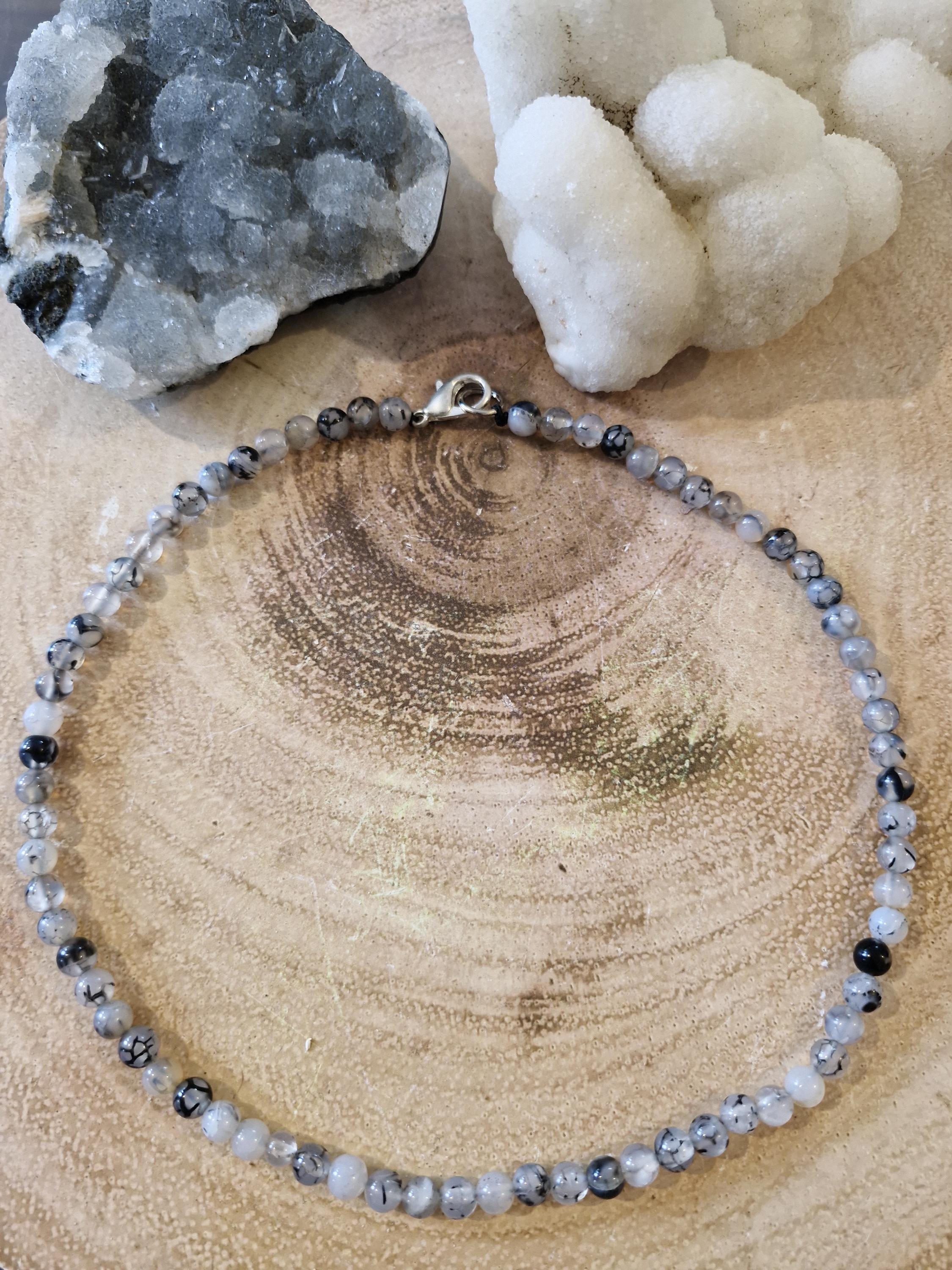 A variety of hand made gemstone/crystal beaded choker necklaces with sliver clasps.