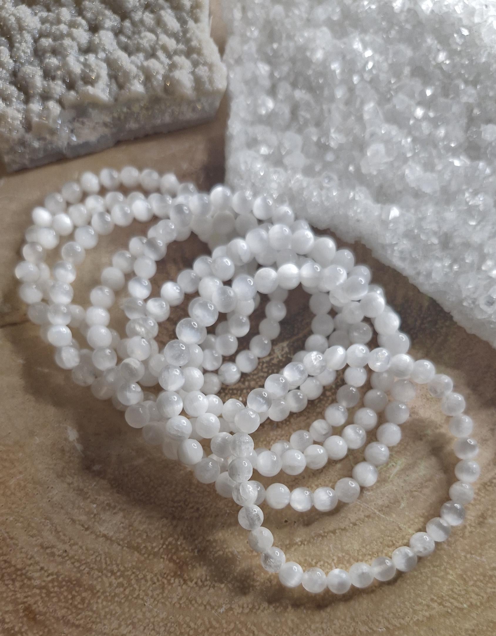 Natural Selenite hand crafted stretchy crystal bracelets. Each one 6mm in size.
