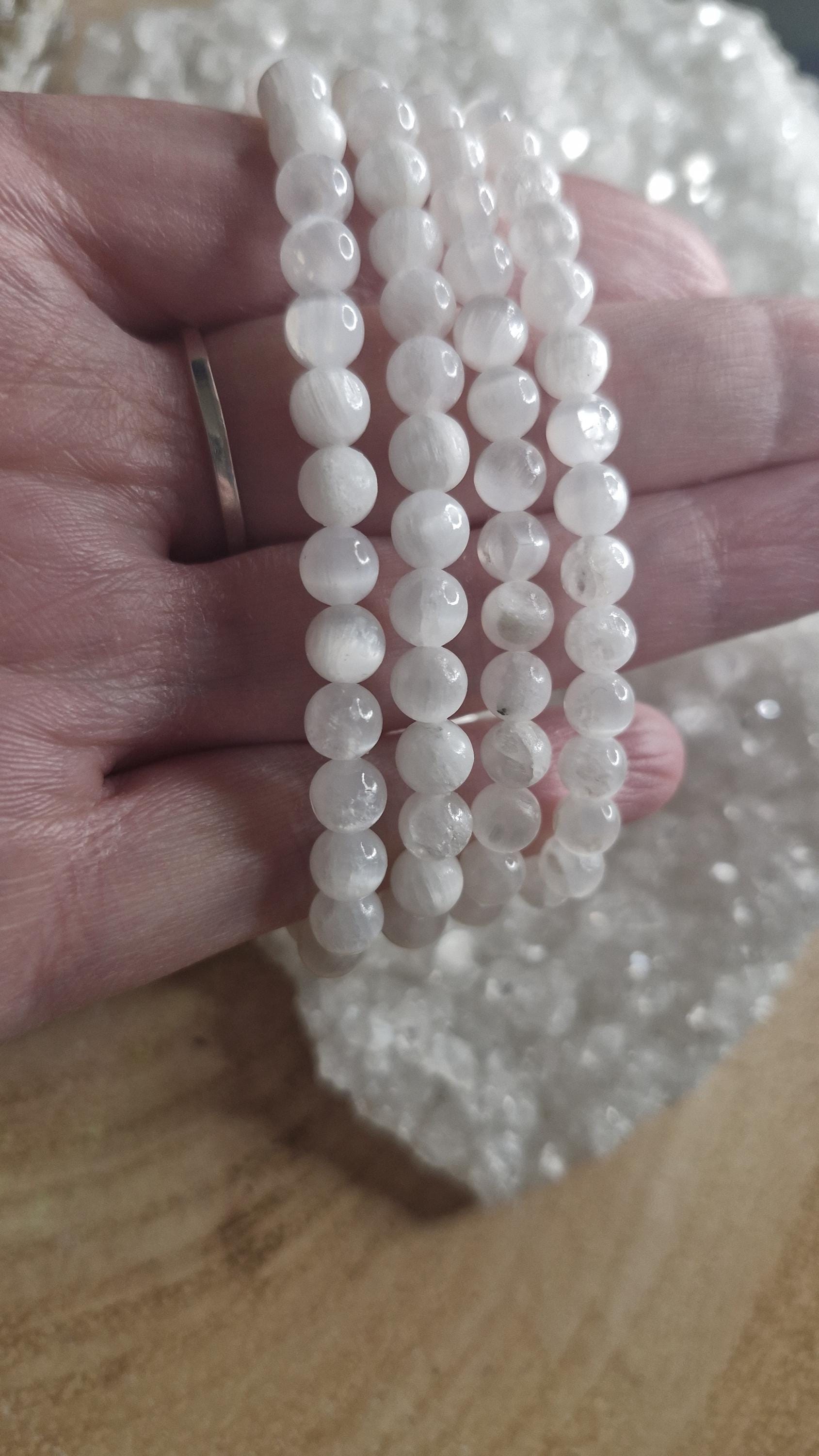 Natural Selenite hand crafted stretchy crystal bracelets. Each one 6mm in size.
