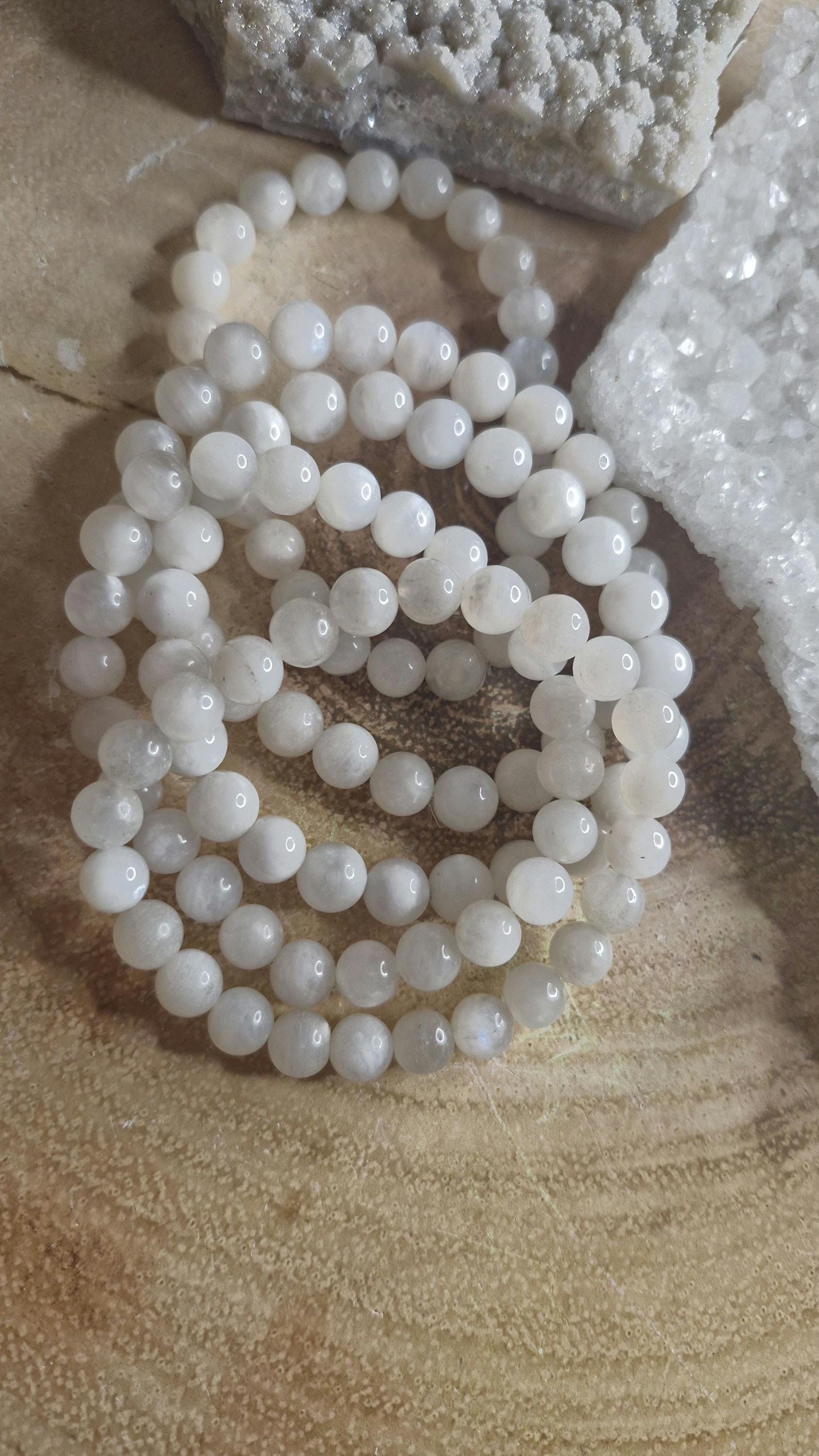 Natural chipped and beaded flashy white Moonstone crystal bracelets with stretchy band.