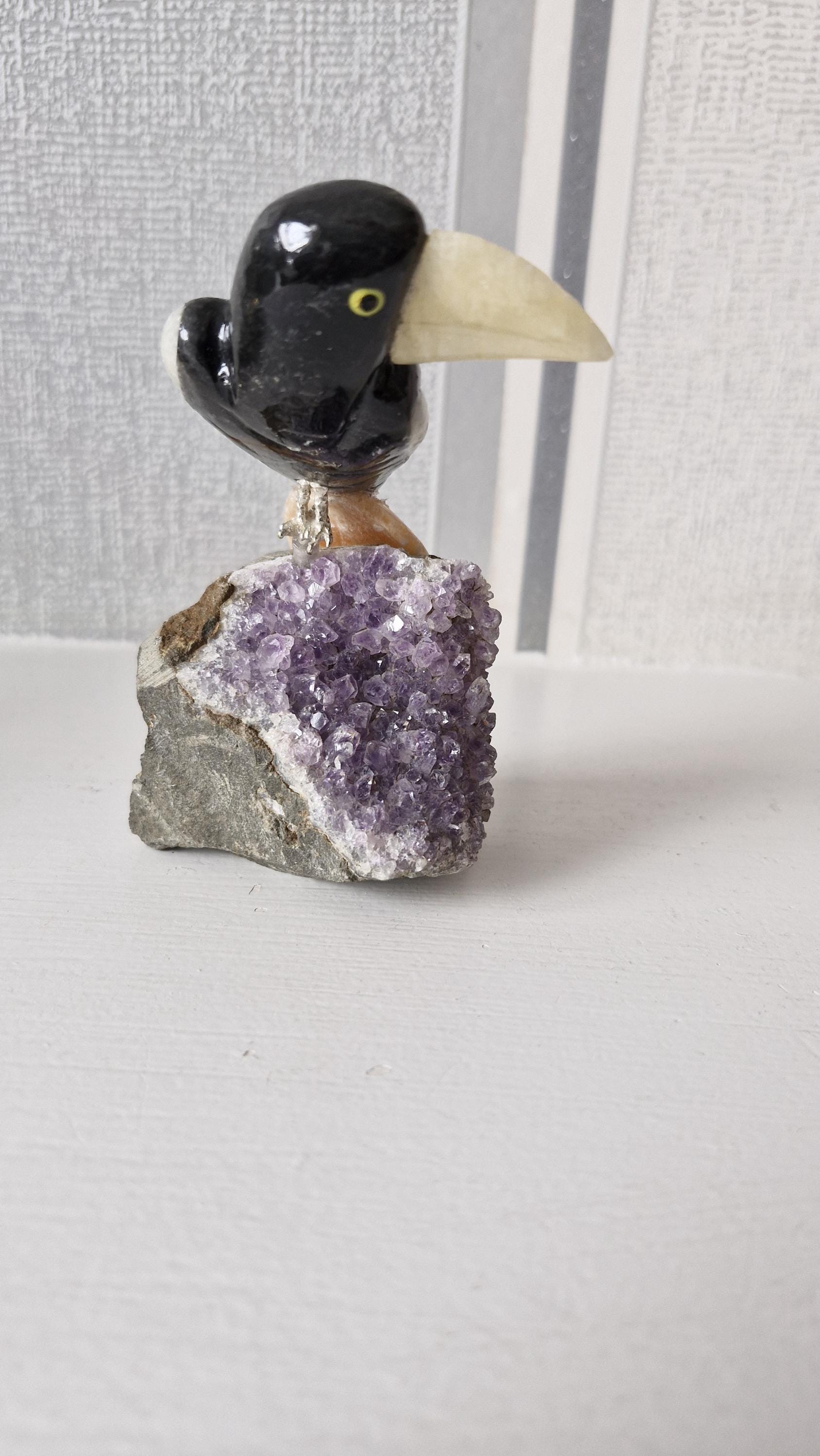 Hand carved gemstone/ crystal birds of Paradise. Bird detachable and has a Amethyst base.