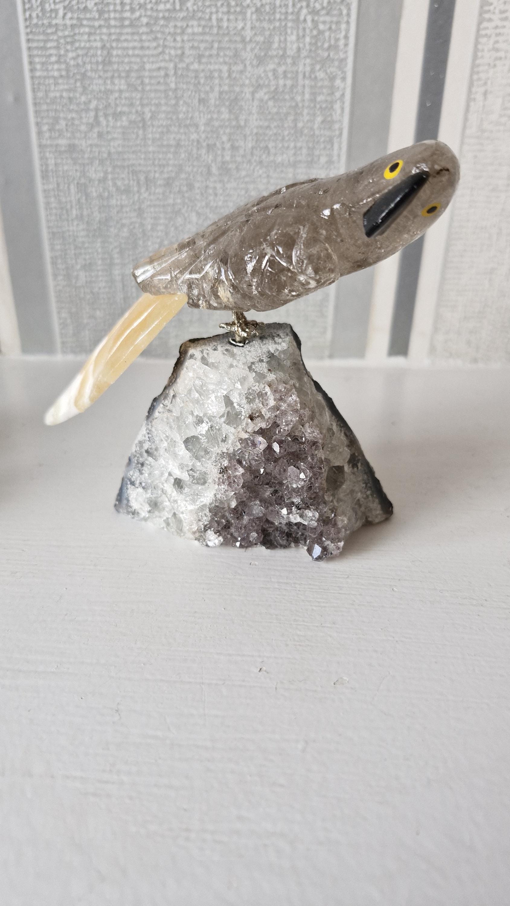 Hand carved gemstone/ crystal birds of Paradise. Bird detachable and has a Amethyst base.