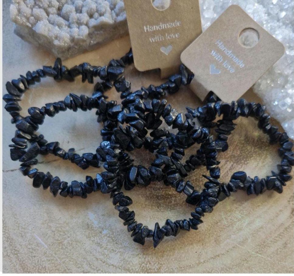 Variety of Natural Chipped Crystal Bracelets. Each one has a stretchy adjustable band.