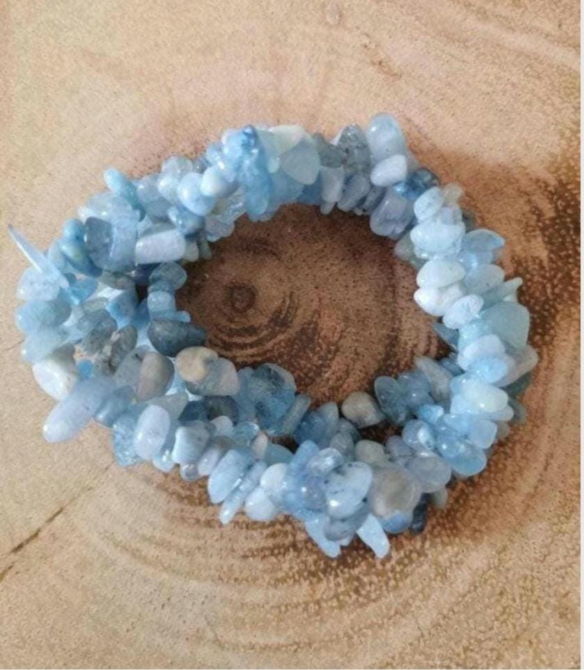Variety of Natural Chipped Crystal Bracelets. Each one has a stretchy adjustable band.