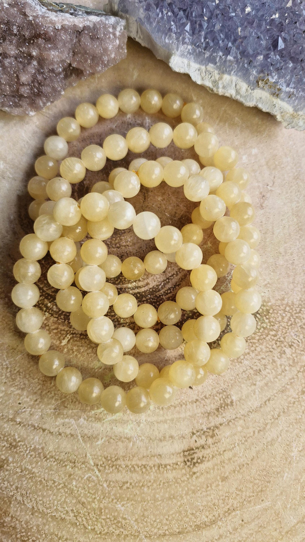 Orange Calcite crystal bracelets 8mm in size. With adjustable stretchy bands.