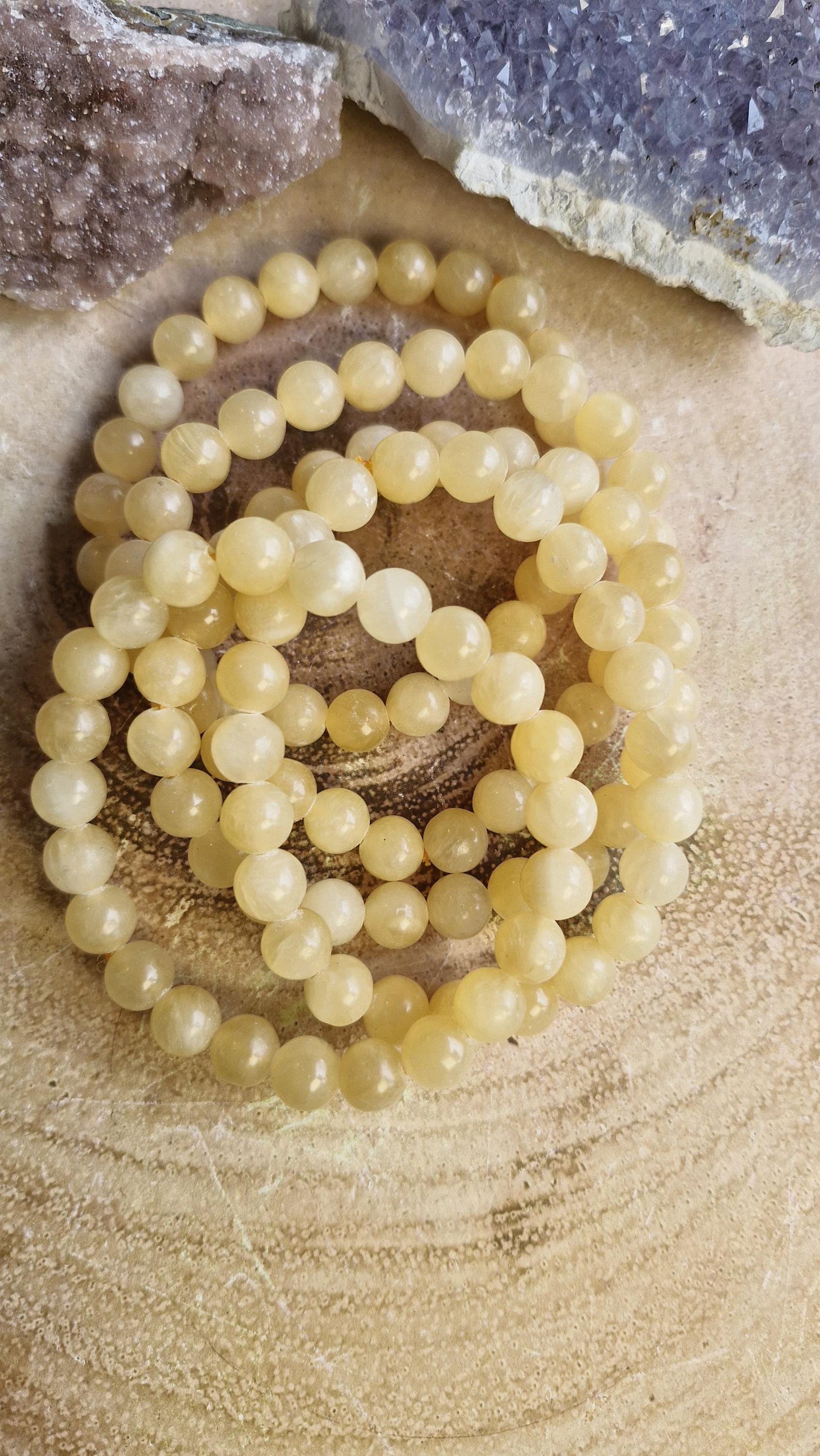 Orange Calcite crystal bracelets 8mm in size. With adjustable stretchy bands.