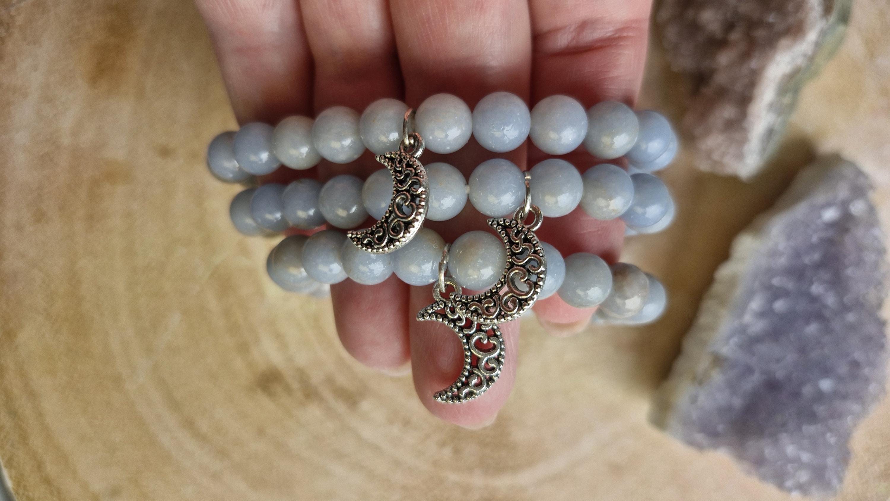 Natural Angelite and Red Jasper crystal bracelets with a silver moon charm.
