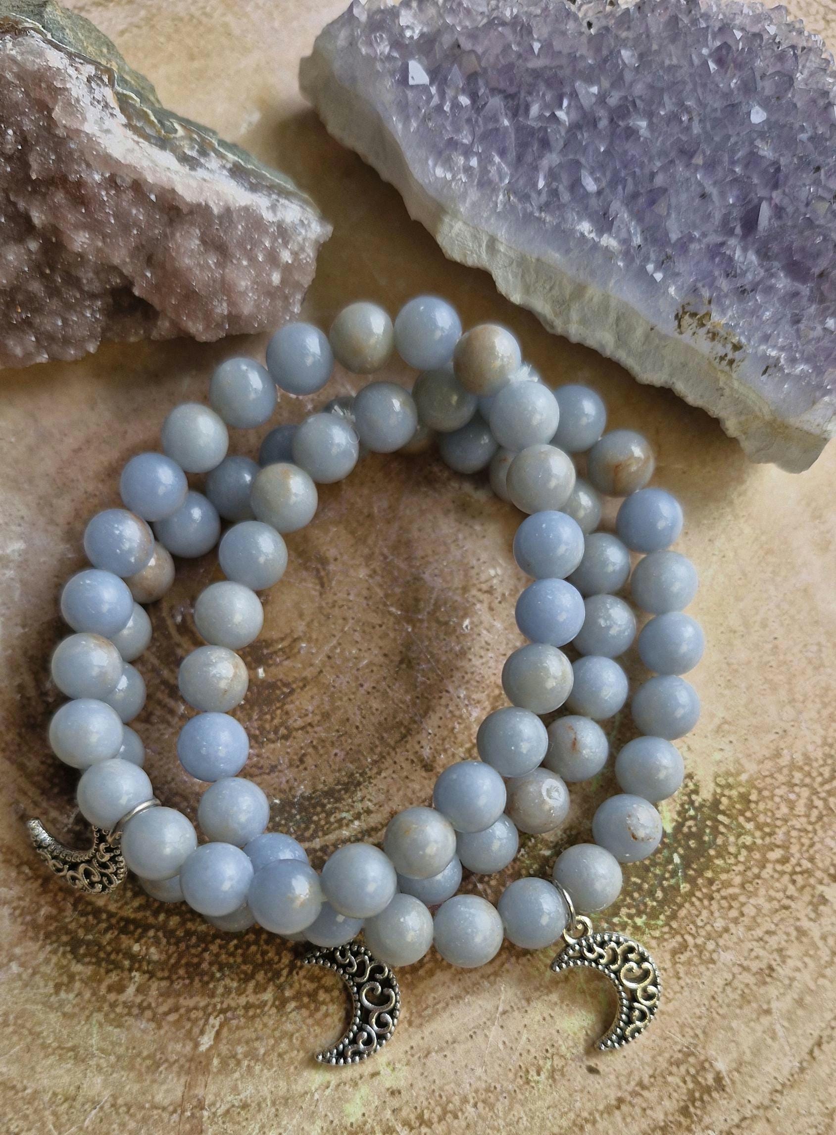 Natural Angelite and Red Jasper crystal bracelets with a silver moon charm.
