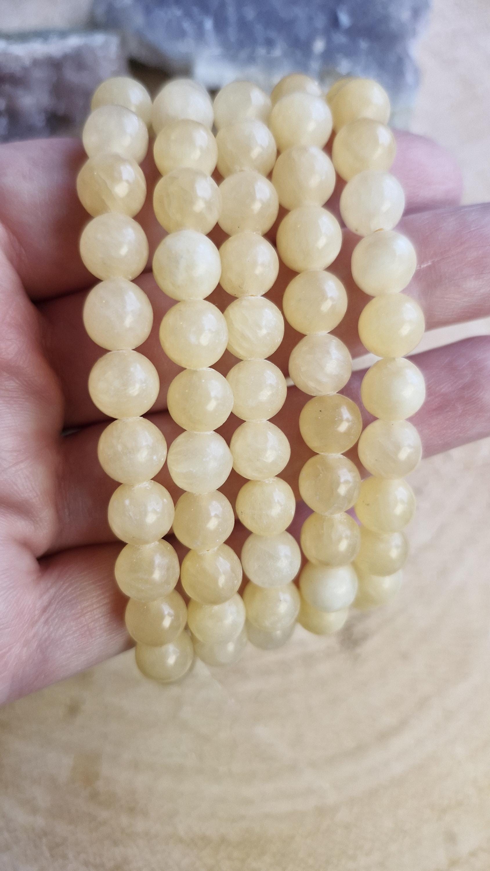 Orange Calcite crystal bracelets 8mm in size. With adjustable stretchy bands.