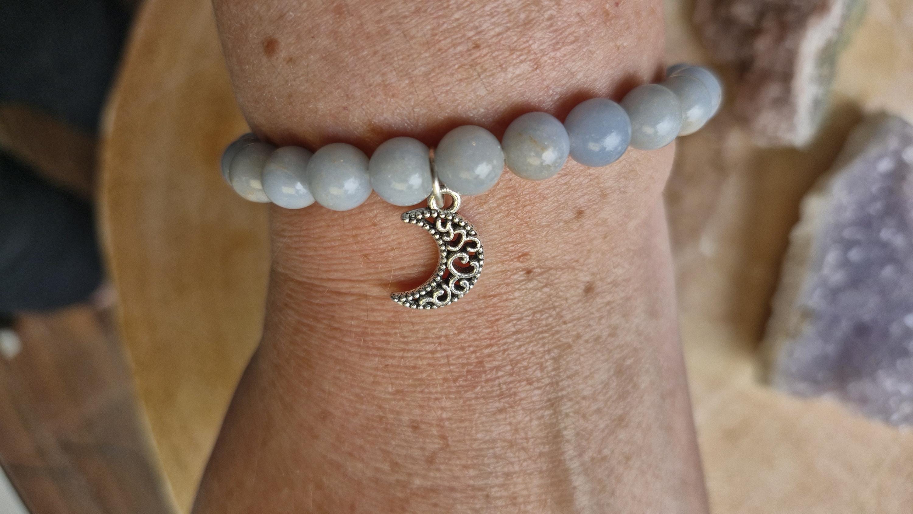 Natural Angelite and Red Jasper crystal bracelets with a silver moon charm.
