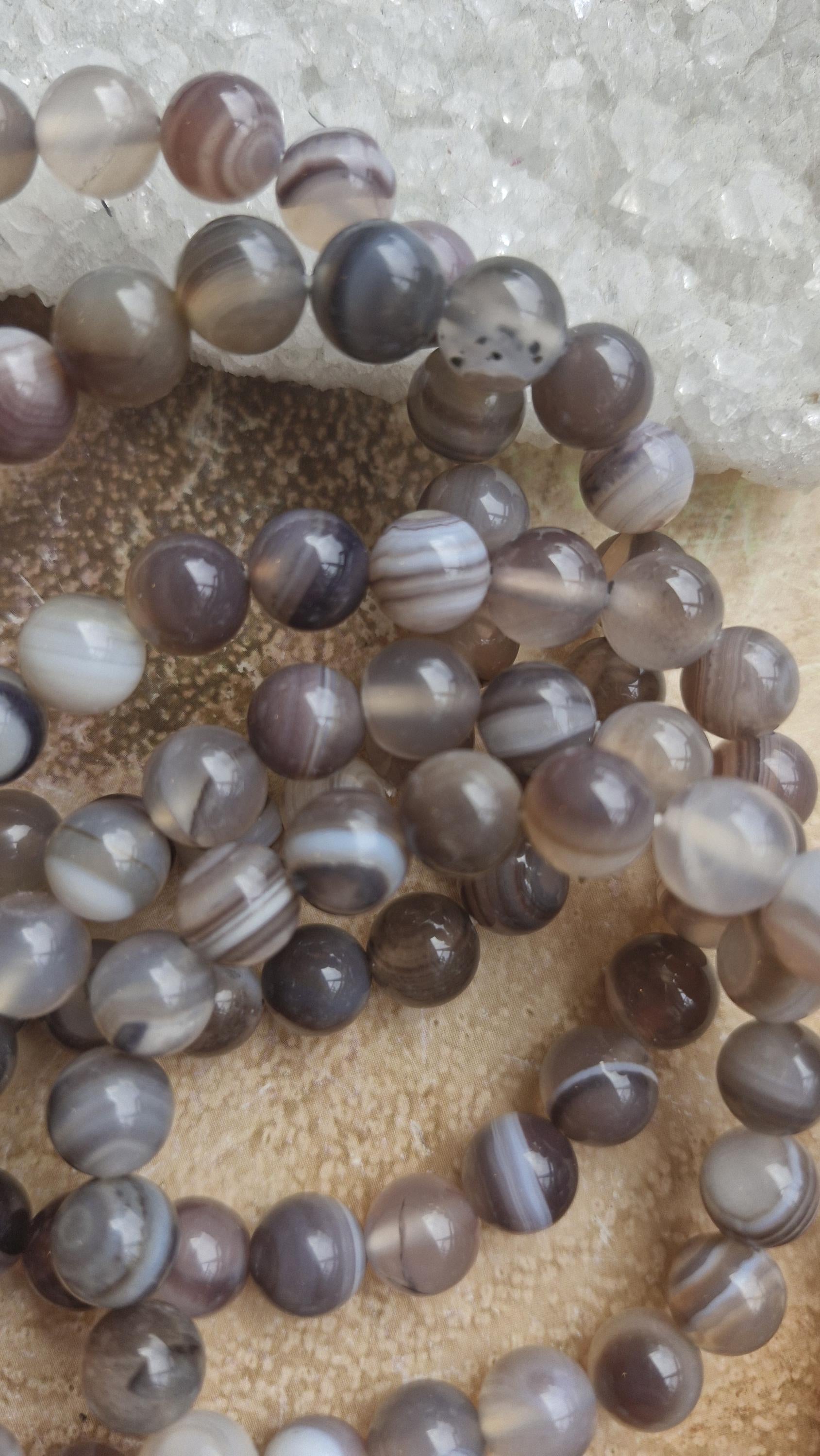 Botswana Agate Crystal Bracelets with adjustable stretchy band.
